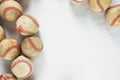 Old used baseballs as sports frame on white background