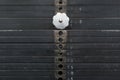 Old and used black weight stack with white numbers in a gym. Rusty flat metal weights. Royalty Free Stock Photo