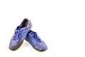 Old used blue worn out futsal sports shoes on white background soccer sportware object isolated Royalty Free Stock Photo