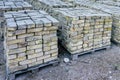 Old used bricks, stacked into cubes on pallets Royalty Free Stock Photo