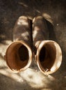 Old and used brown work boots, shot from above on a shed floor Royalty Free Stock Photo