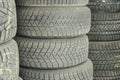 Old and used car tires. Background. Car tires in storage. Car tire recycling Royalty Free Stock Photo