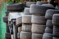 Old used car tires. A pile of black tires, abstract background. Royalty Free Stock Photo