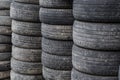 Old used car tires stacked in stacks