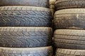 Old used car tires stacked up in the storage area Royalty Free Stock Photo