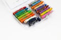 Old used colored crayons for drawing isolated on a white background. Concept of Creativity, school, and childhood Royalty Free Stock Photo