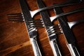 Old used cutlery on dark wooden table Royalty Free Stock Photo