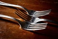 Old used cutlery on dark wooden table Royalty Free Stock Photo