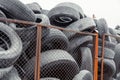 Old used damaged car tires at the dump