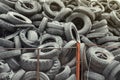 Old used damaged car tires at the dump