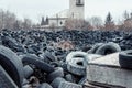 Old used damaged car tires at the dump