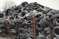 Old used damaged car tires at the dump