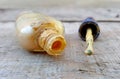 old used dirty nail polish bottle on wood cement background