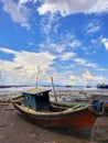 old used fisherman\'s stranded boat