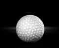 Old used golf ball on black background Royalty Free Stock Photo