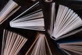 Old and used hardback books, text books seen from above on wooden floor. Books and reading are essential for self improvement, ga