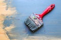Old used paint brush on partial paint wood background. Diagonal Royalty Free Stock Photo