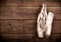 Old used pink ballet shoes hanging Royalty Free Stock Photo