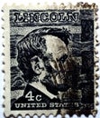 An old used postage stamp printed in the USA with the image of Abraham Lincoln (1809-1865), circa 1965. Royalty Free Stock Photo