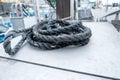 An old, used rope somewhere on a boat at the harbor