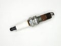 an old used rusty copper spark plug