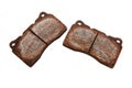 The old used and rusty disc brake pads