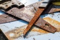 Old, used rusty wood saws close up shot