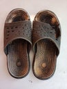 old and used sandals, worse bitten by a rat.