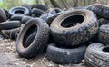 Old used tires dumped in the forest Royalty Free Stock Photo