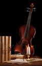 Old used violin with antique items Royalty Free Stock Photo