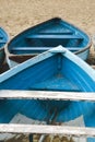 Old used wooden row boat on a sandy beach sand Royalty Free Stock Photo