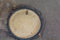 Old utility manhole in street