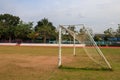 Old vacant football soccer goal gate in rural grass field in Chiang Mai,Thailand Royalty Free Stock Photo