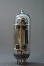 Old vacuum tube on gray background Royalty Free Stock Photo