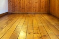 Old varnished wooden floor and wall of room Royalty Free Stock Photo