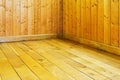 Old varnished wooden floor and wall of room Royalty Free Stock Photo