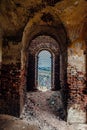 Old vaulted corridor of ruined abandoned church Royalty Free Stock Photo