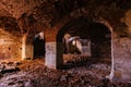 Old vaulted red brick cellar under abandoned building