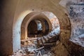 Old vaulted red brick cellar under abandoned building