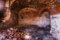 Old vaulted red brick cellar under abandoned building