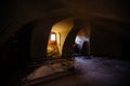 Old vaulted red brick cellar under abandoned building