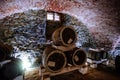 Old red brick vaulted wine cellar with barrels Royalty Free Stock Photo