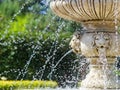 Old Venetian fountain in the park. The water flows beautifully