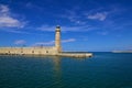 City Of Chania, Crete. Old Venetian harbour with a view of the lighthouse, against the blue sky, on a clear Sunny day