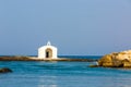 Old venetian lighthouse at harbor in Crete, Greece. Small cretan village Kavros.