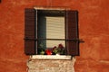 Old Venetian window at sunset,Italy