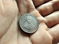Old version of a 5 Thai bath coin. Royalty Free Stock Photo
