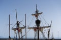 Old vessel boat wooden masts, folded white sails Royalty Free Stock Photo