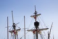 Old vessel boat wooden masts, folded white sails Royalty Free Stock Photo