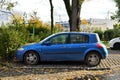 Old veteran metal blue French Renault Megane II with diesel 1.9 engine compact car parked